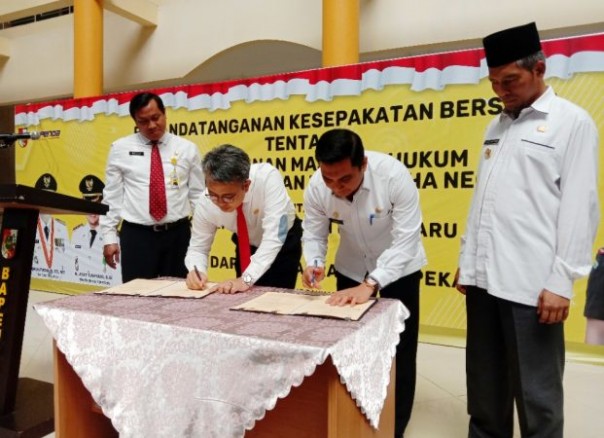 Bapenda kota Pekanbaru lakukan penandatanganan kerjasama dengan Kejaksaan Negeri Pekanbaru.  